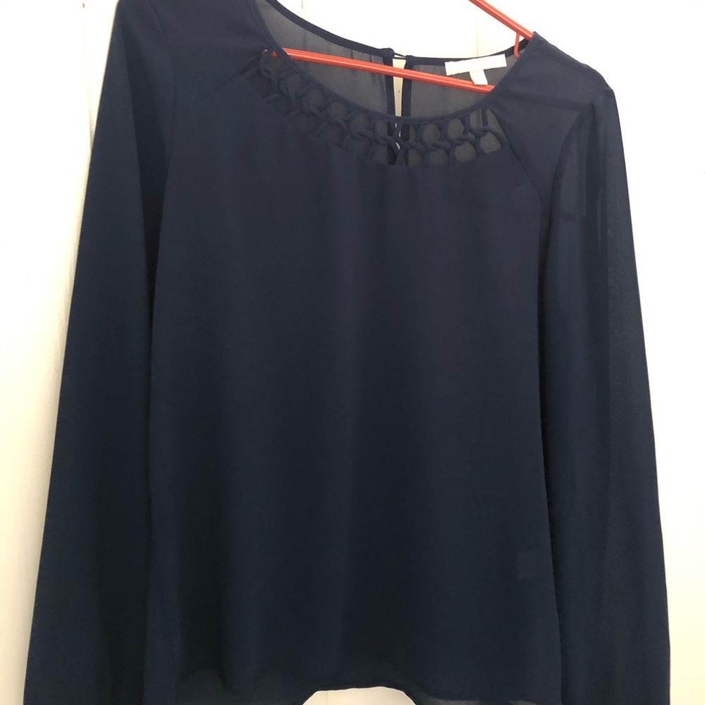 Flowy , sheer, dark blue blouse.
